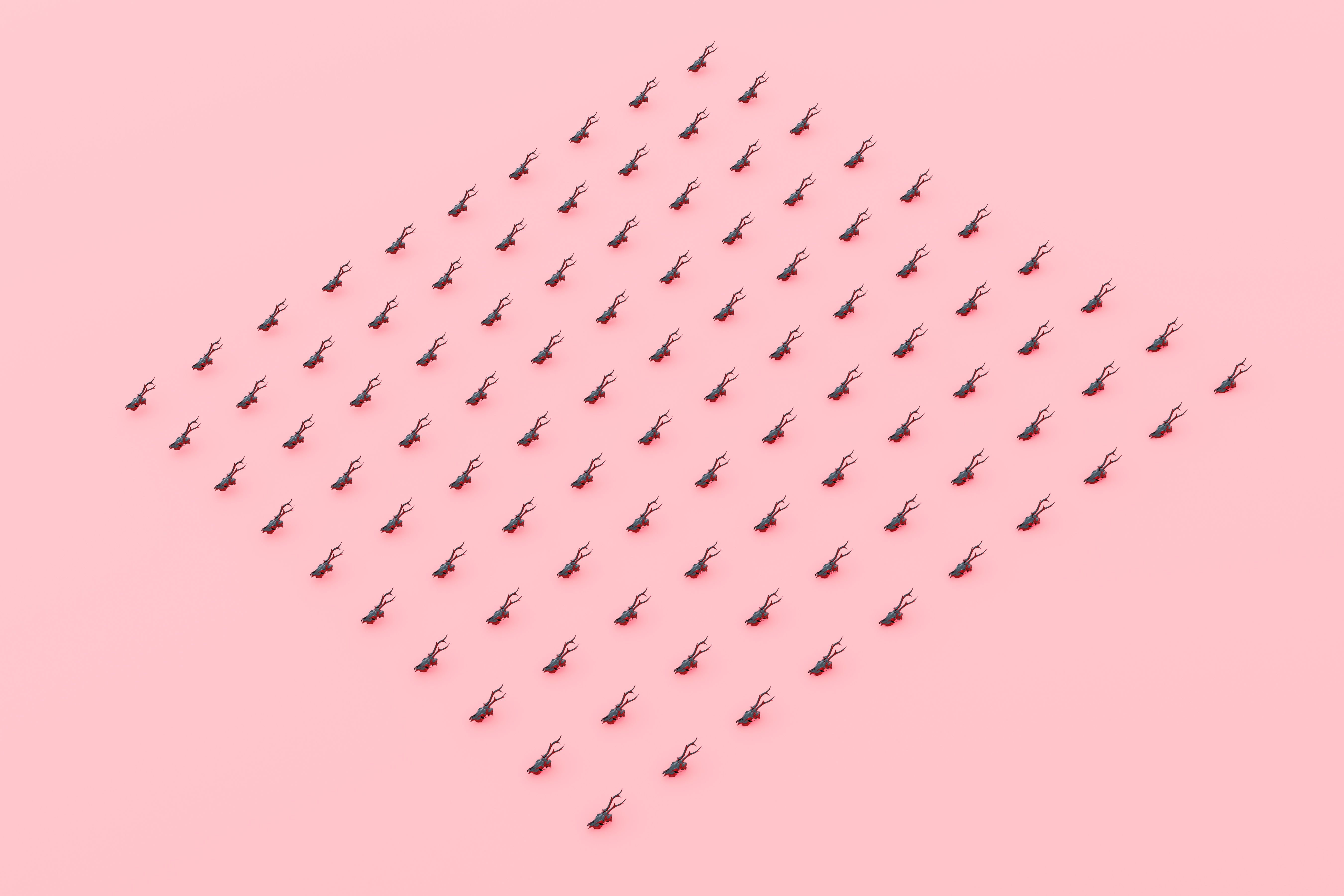 A creative and artistic display of miniature black ants arranged on a pink surface.